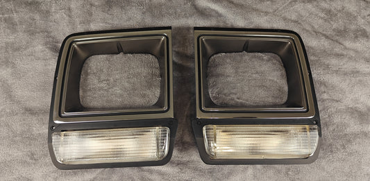 1986-1990 Chrome bezels and clear turn signals.